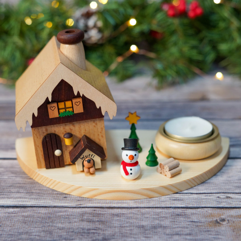 Traditional German smoker house with snowman and dog house