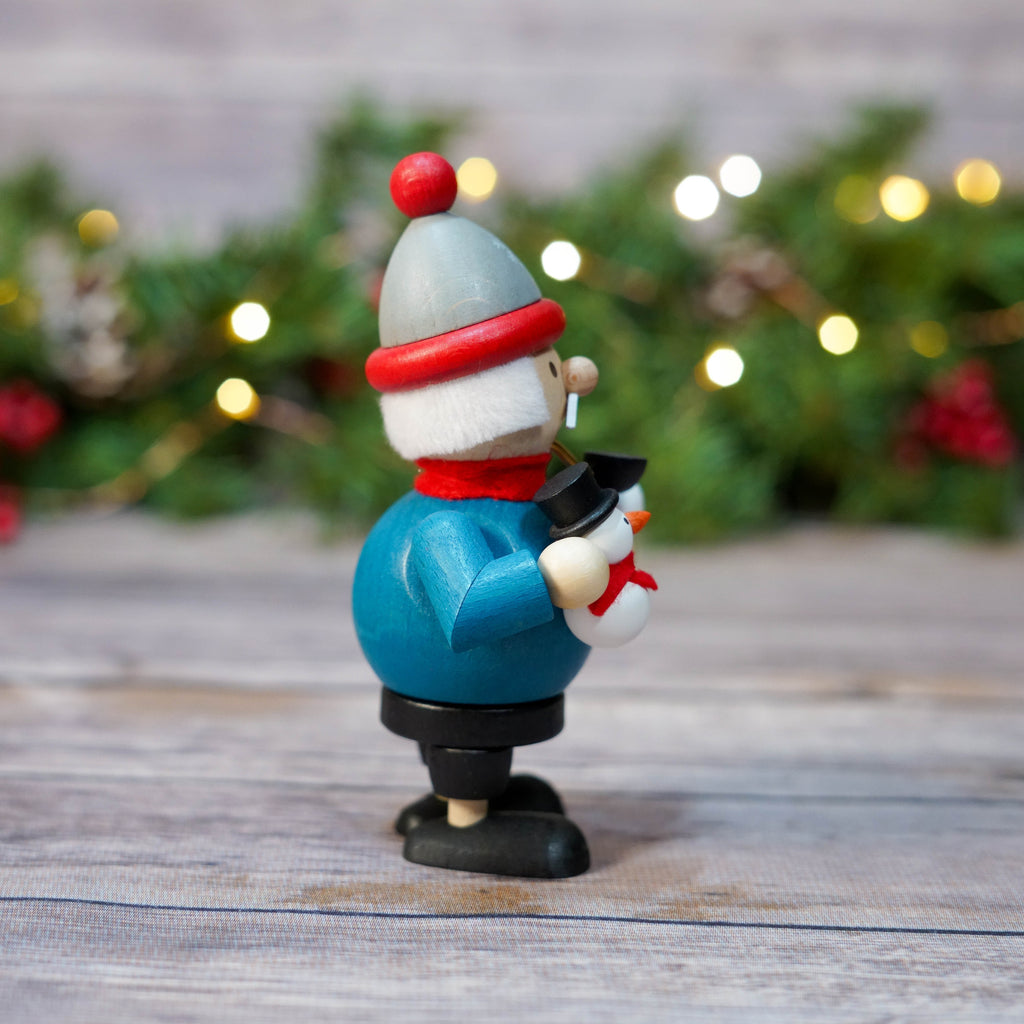 Mini Snowman Smoker displayed against holiday lights backdrop