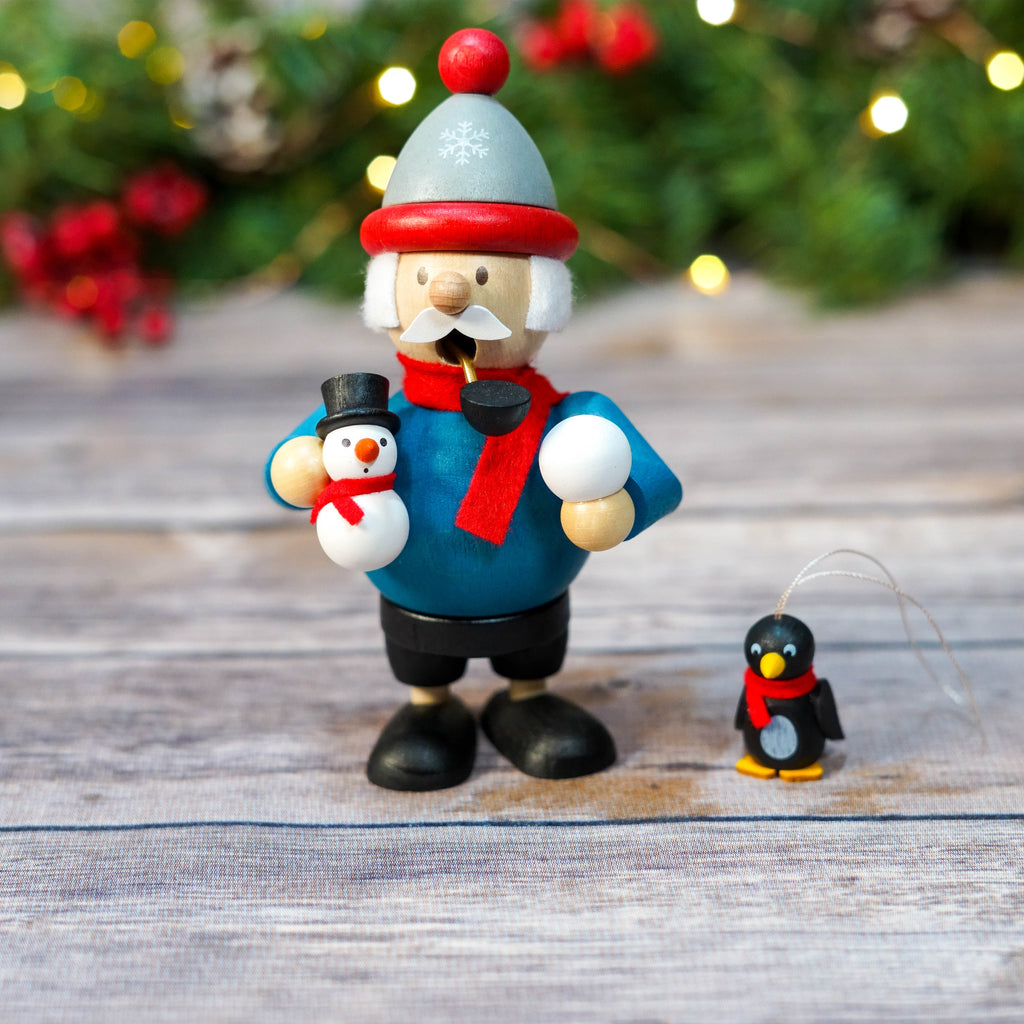 Mini Snowman Smoker next to other Christmas decoration items