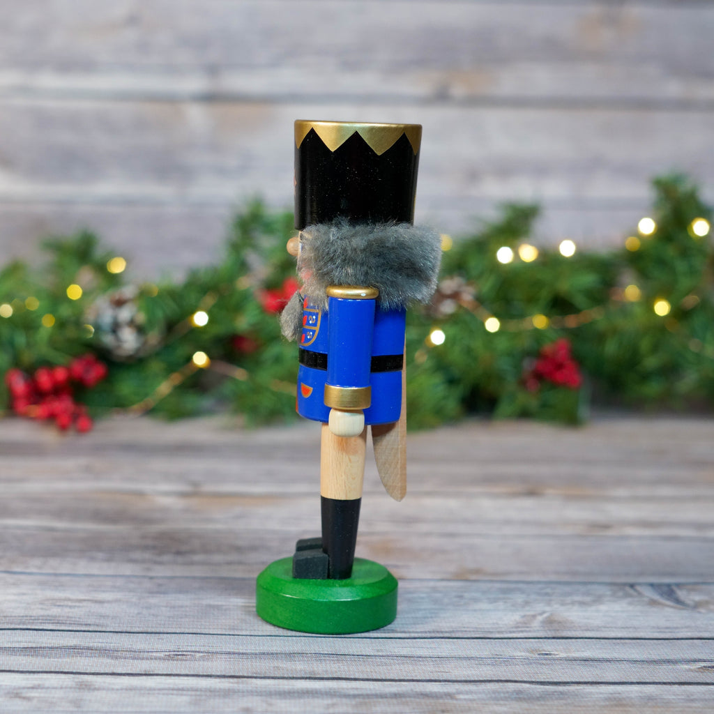 Close-up of blue nutcracker soldier's face with grey beard