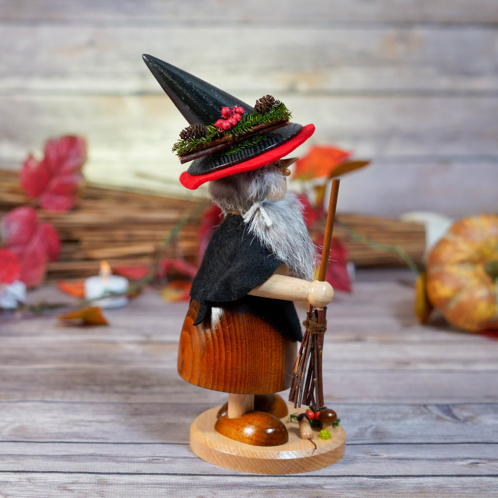 Detailed shot of witch's black cape and hat with red lining