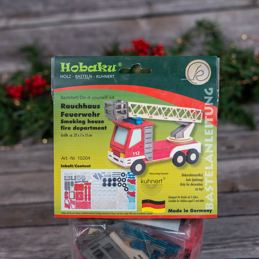 Complete DIY firetruck kit on a festive background