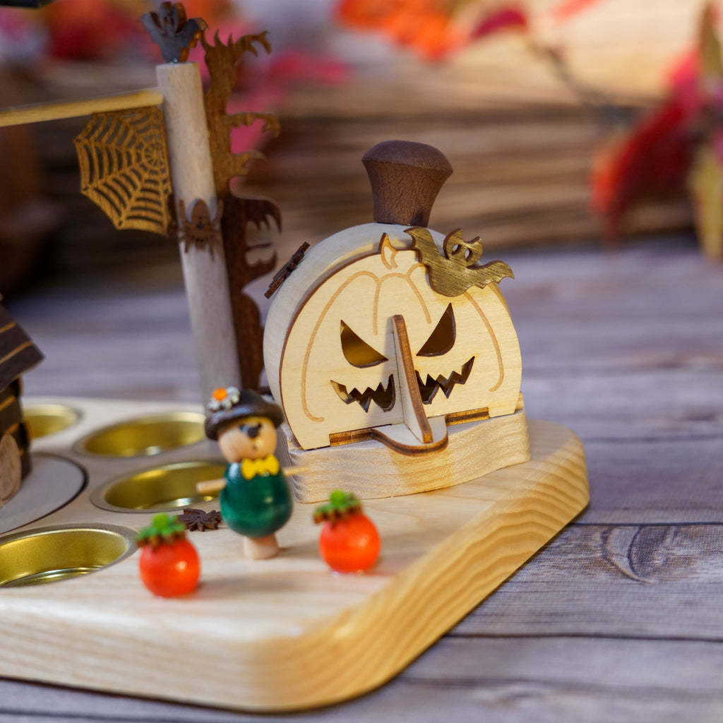 Close-up of Halloween figures beside Haunted House Smoker