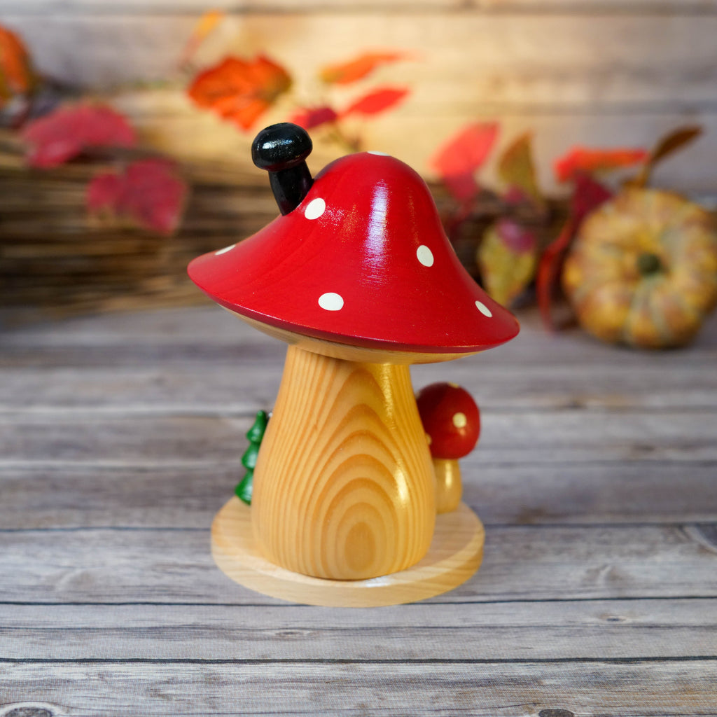 Close-up of Smoker's detailed woodwork and mushroom cap
