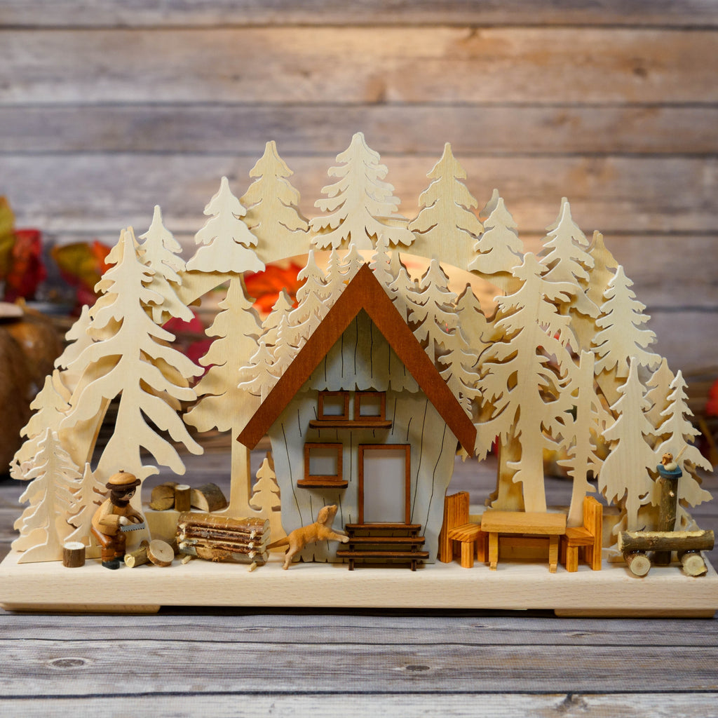 Traditional German Schwibbogen depicting mountain house and forest