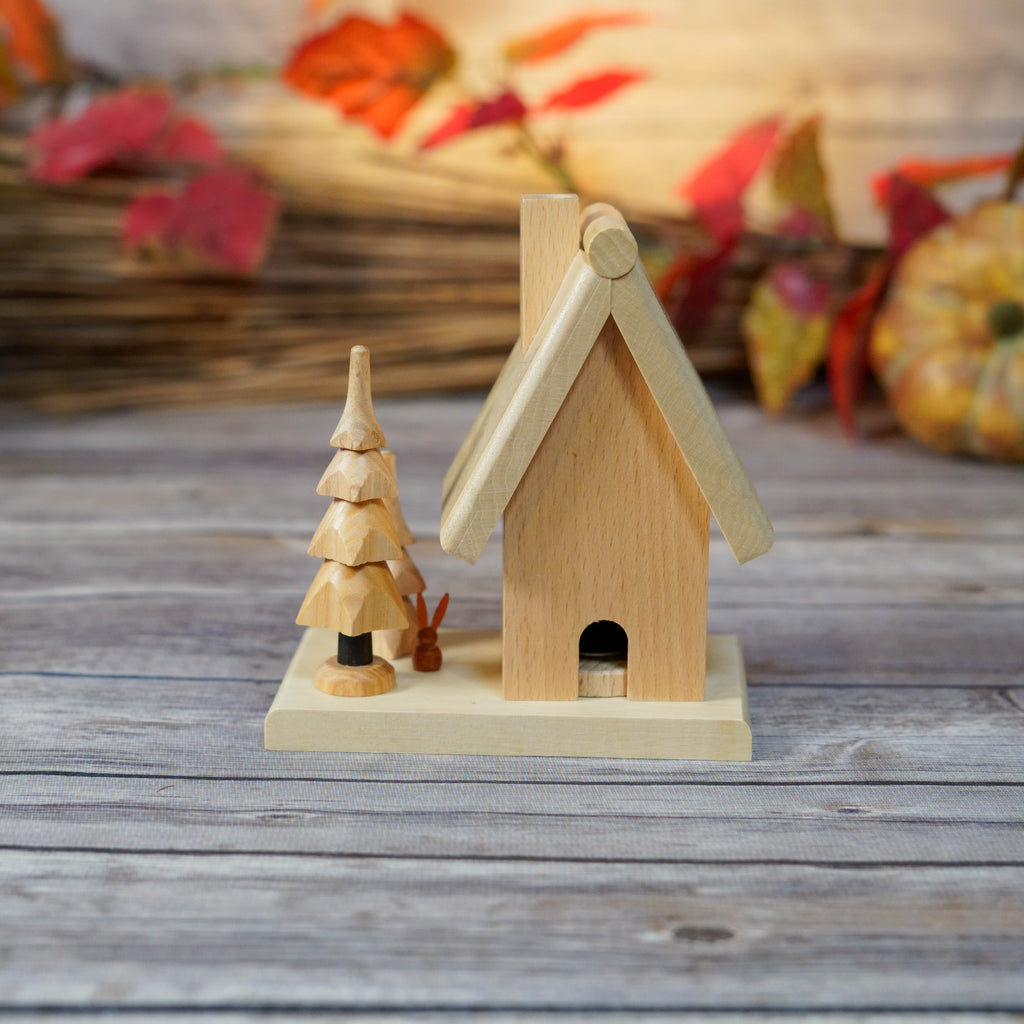 Traditional German-style wooden smoker set against a rustic backdrop