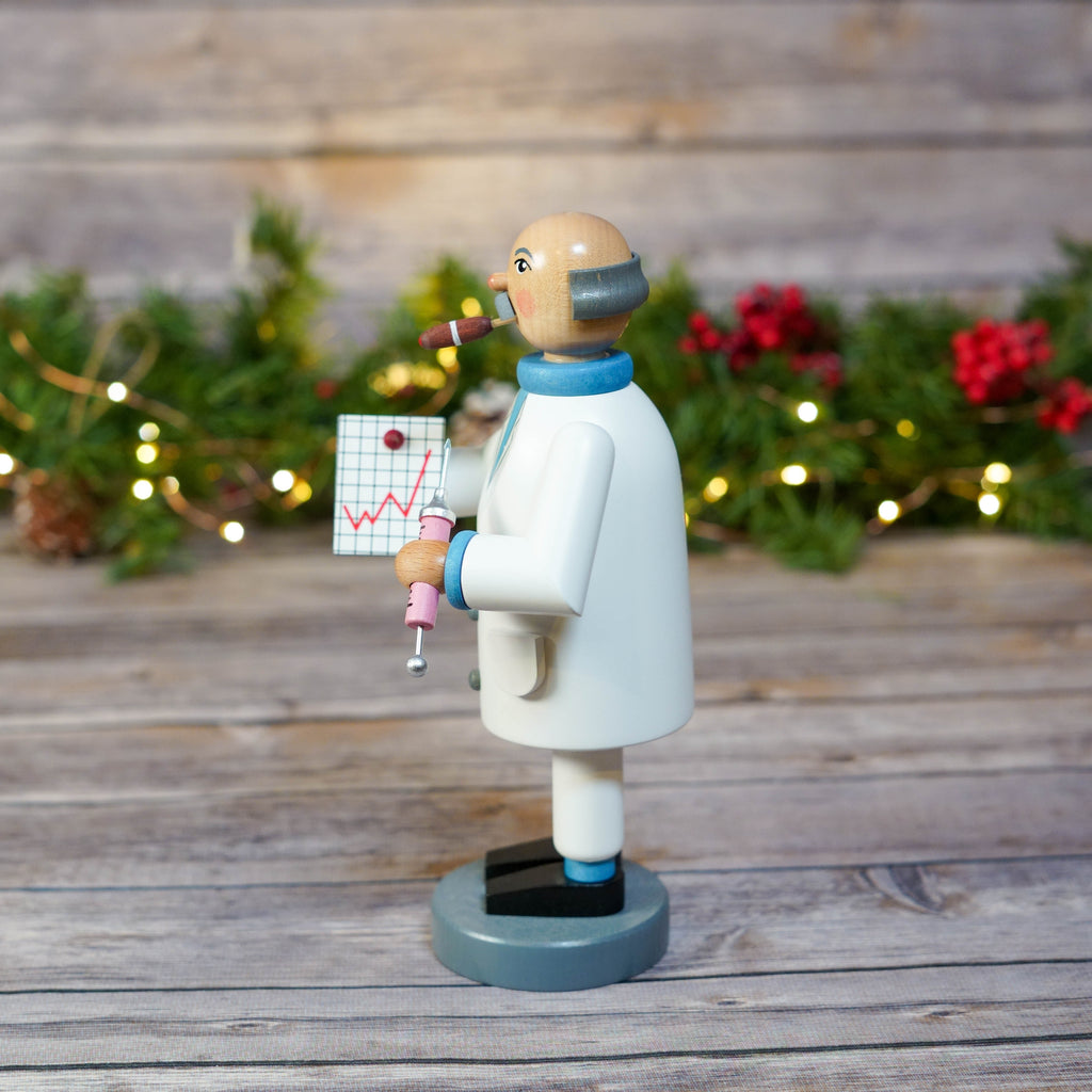 Doctor smoker figure in white coat holding a thermometer