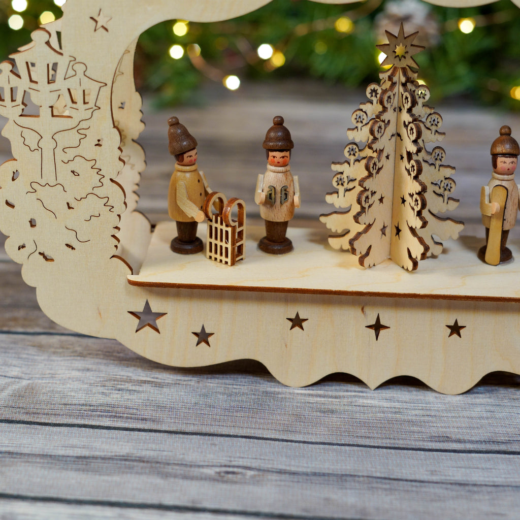 Glowing winter theme window star hung against wood backdrop