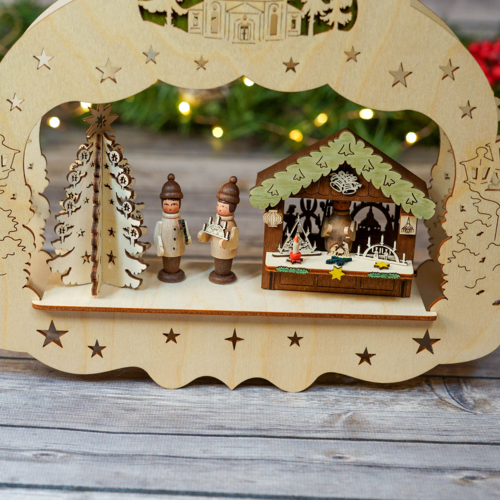 Detailed wooden window star with Christmas market scene