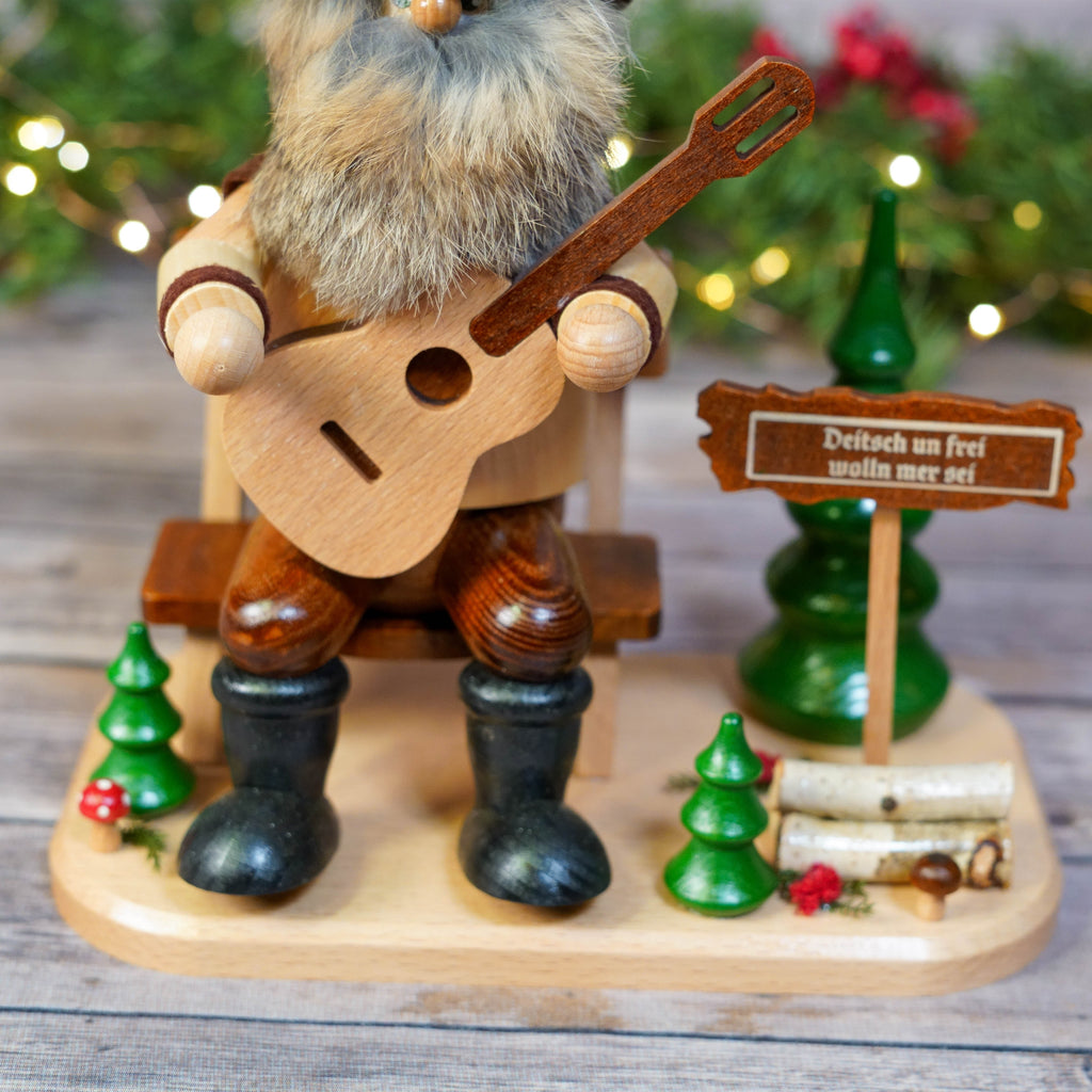 Rustic guitar player smoker with detailed base decorations