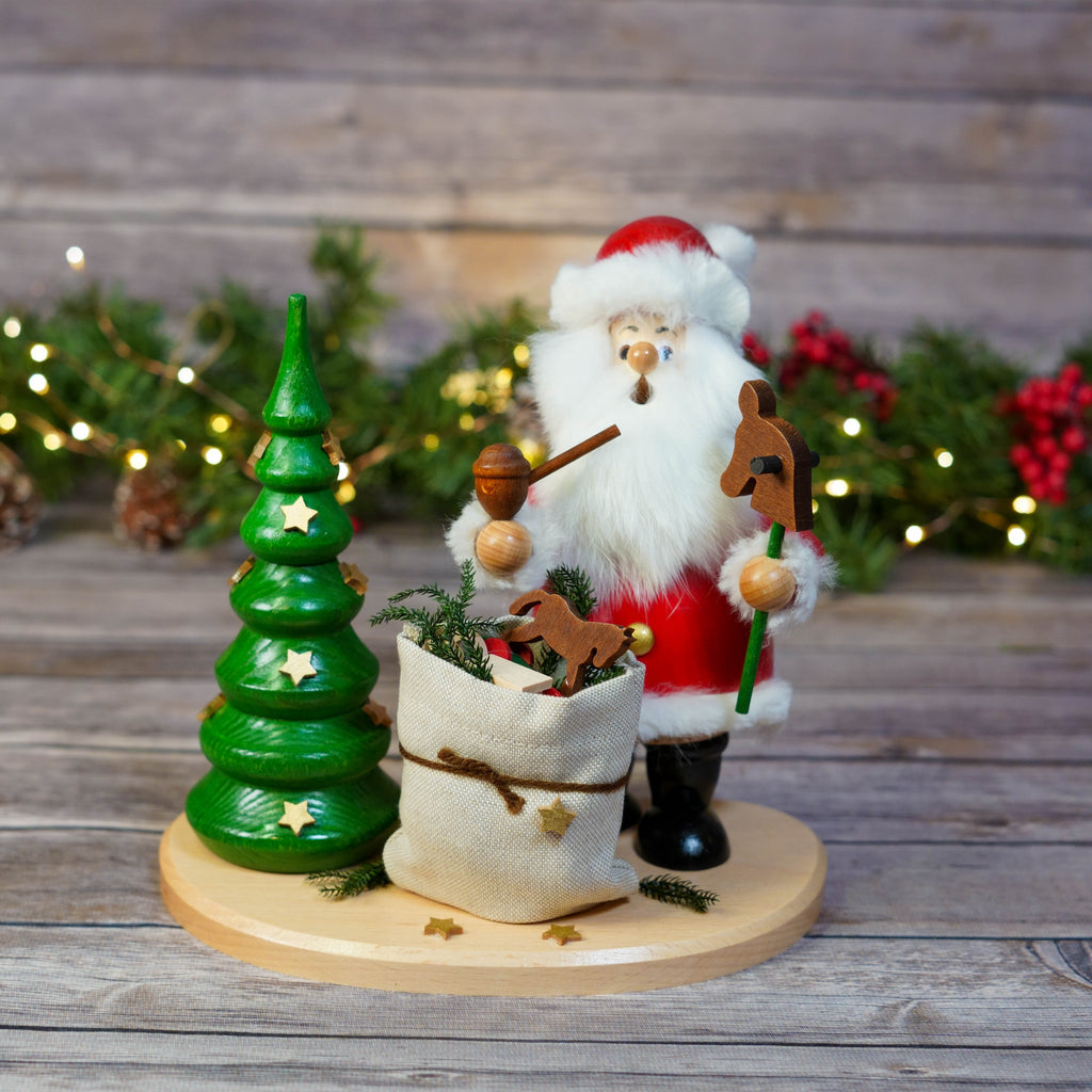 Santa Claus smoker with a Christmas tree and sack