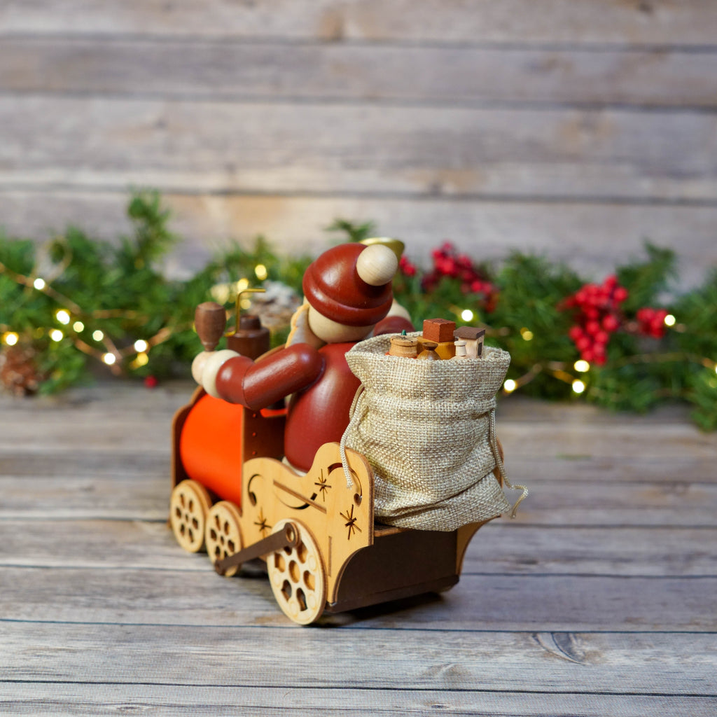 Christmas decorative piece featuring Santa in a wooden train