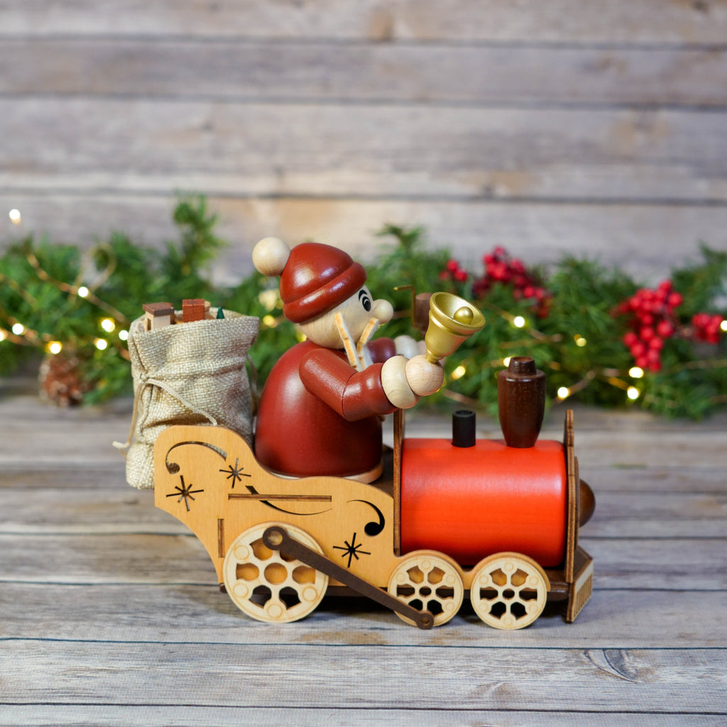Traditional German Santa train smoker with holly and berries