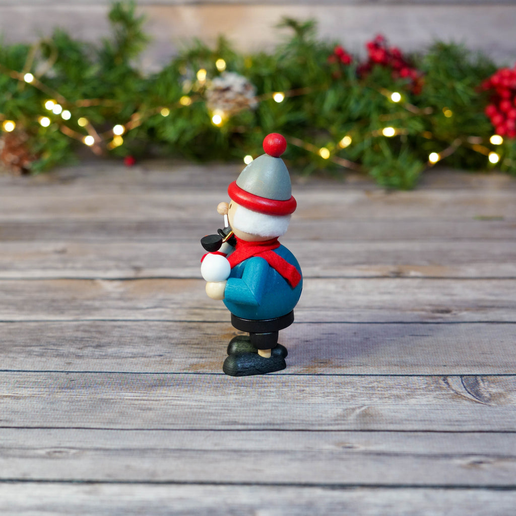 Close-up of mini smoker with detailed snowman sculpture