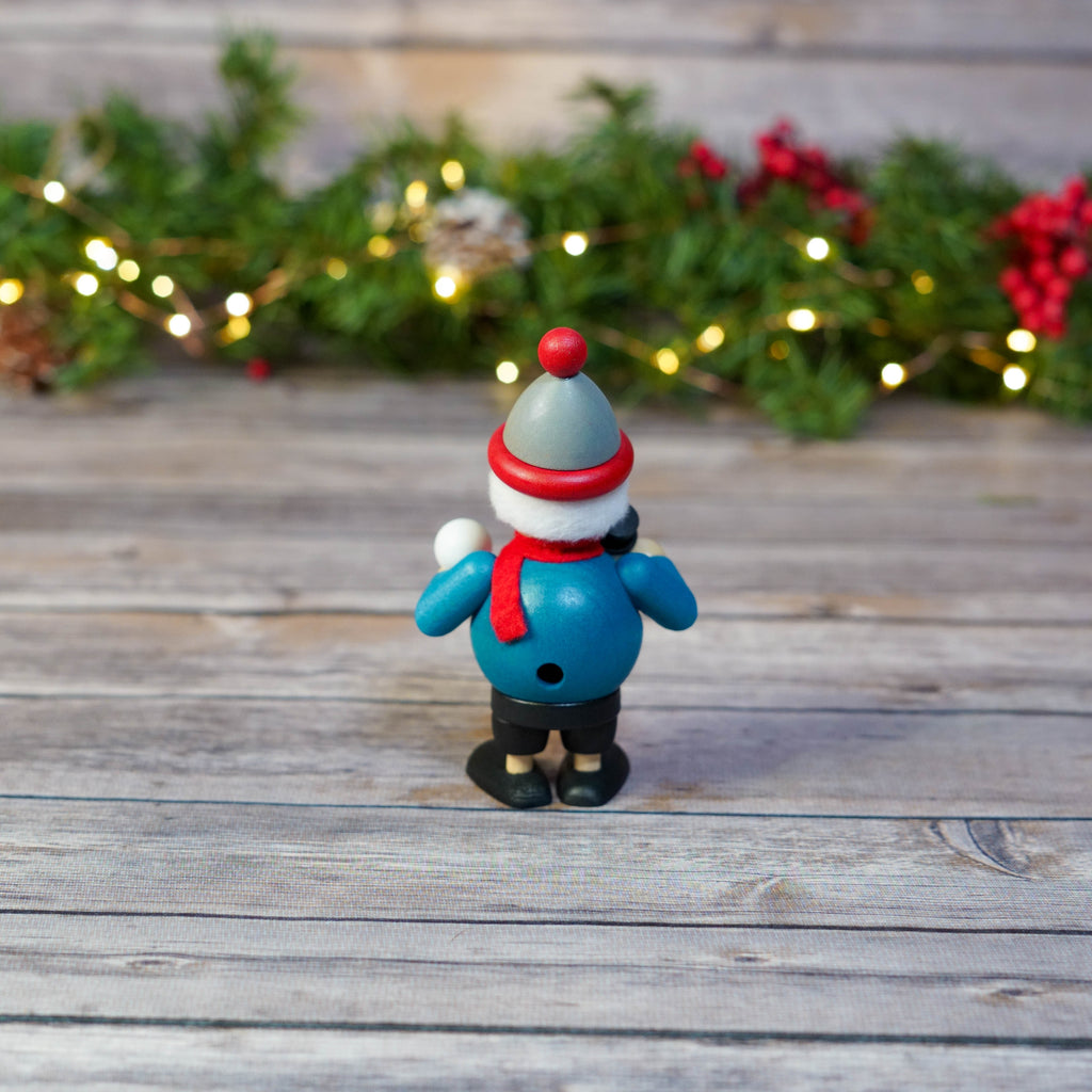 Mini smoker against a holiday-themed backdrop