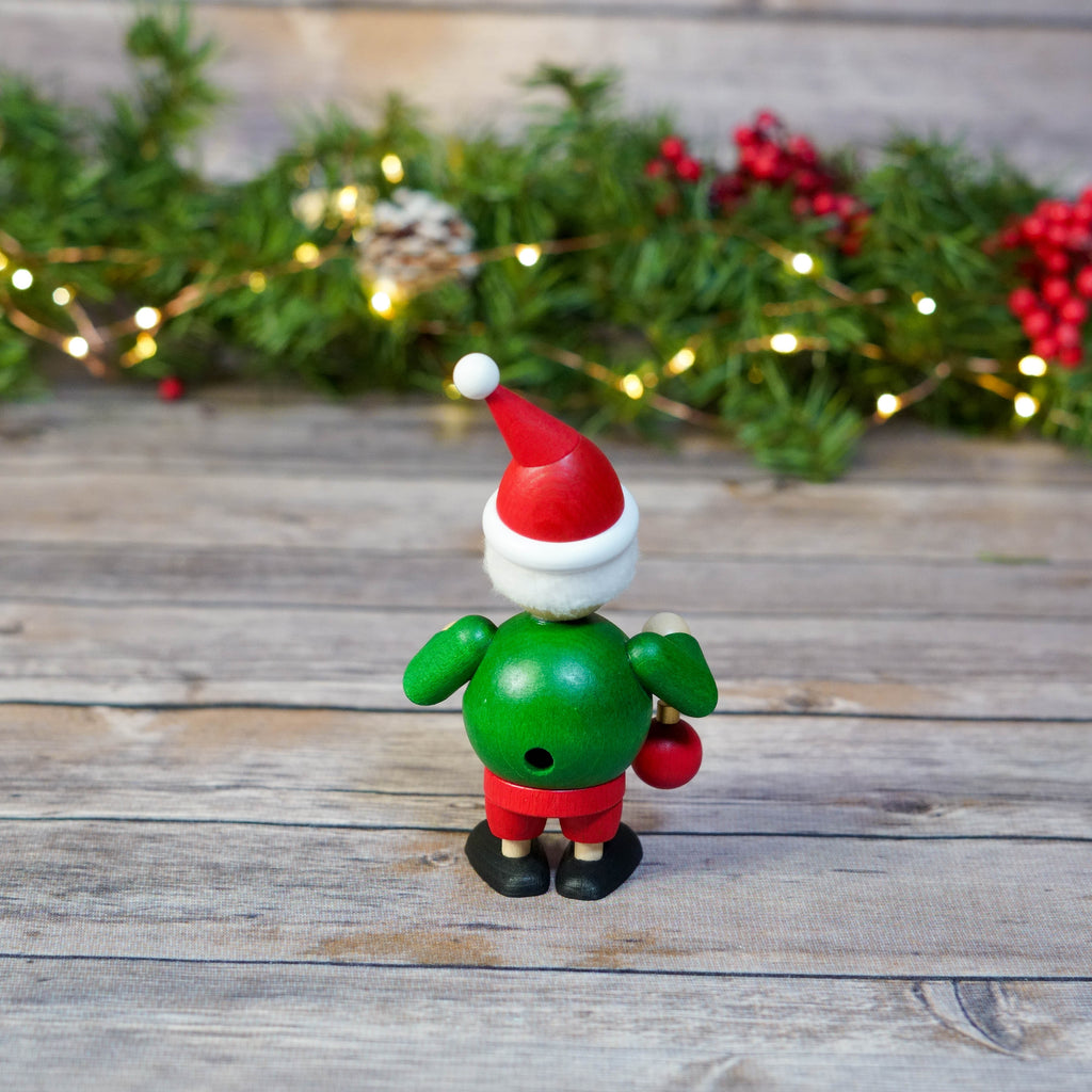Festive mini wooden smoker with fairy lights background