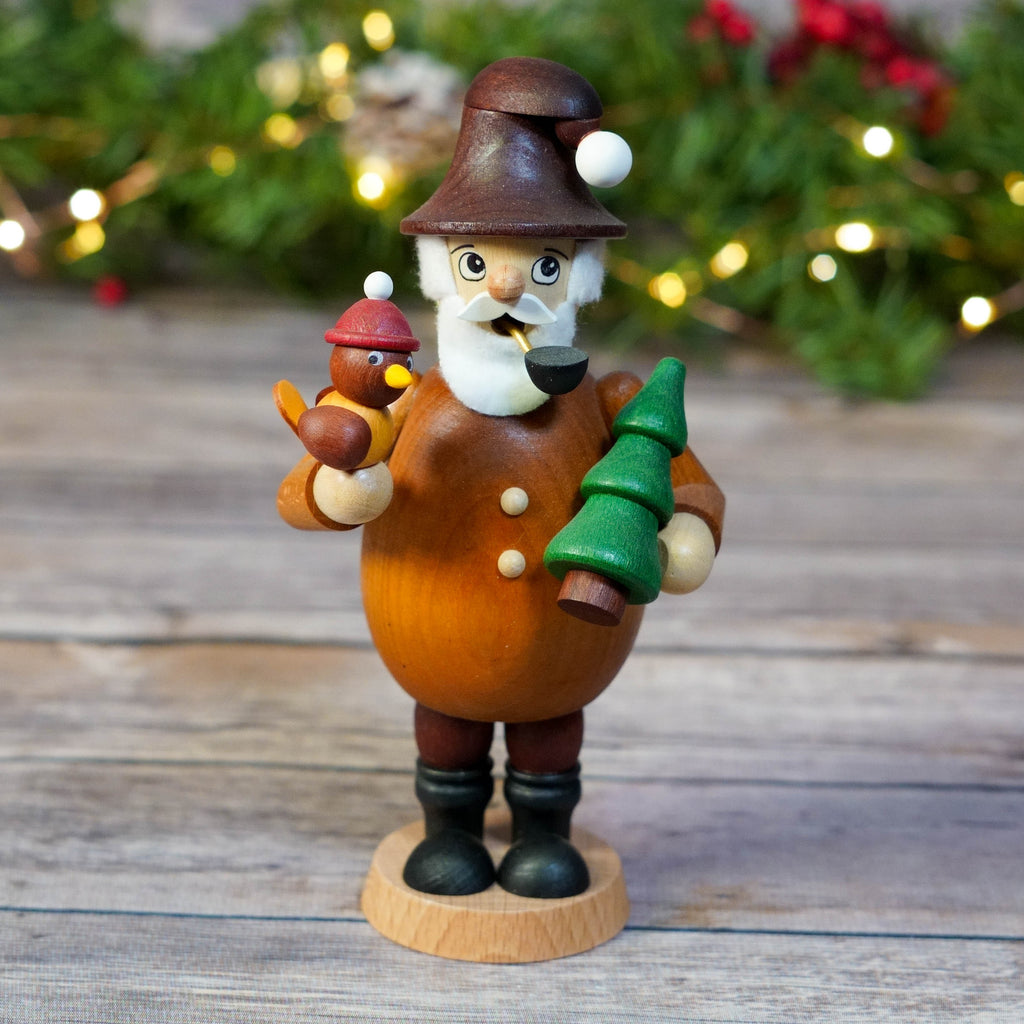 Traditional German Smoker Gnome holding a bird and Christmas tree