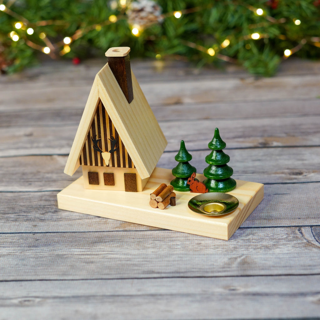 Close-up of wooden smoker house with Christmas decorations