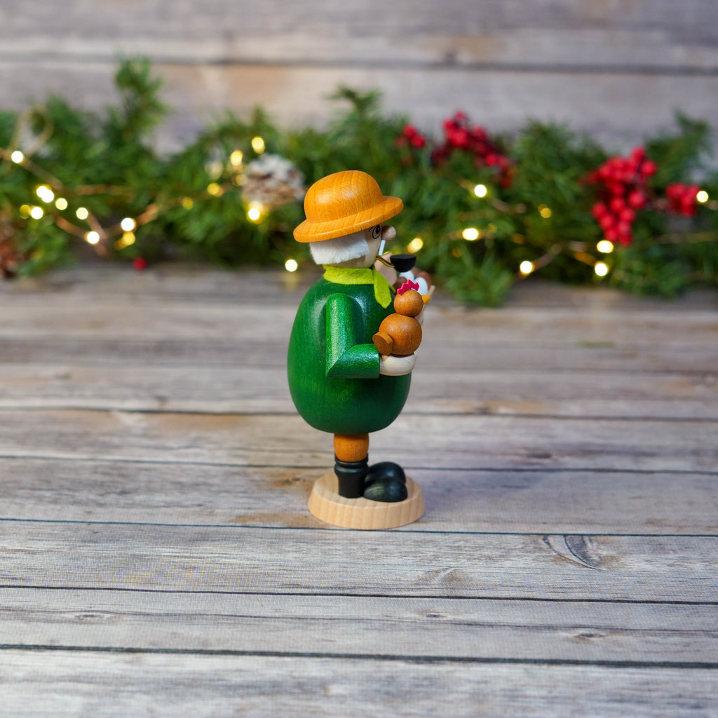 Farmer Smoker on Wooden Background with Christmas Lights