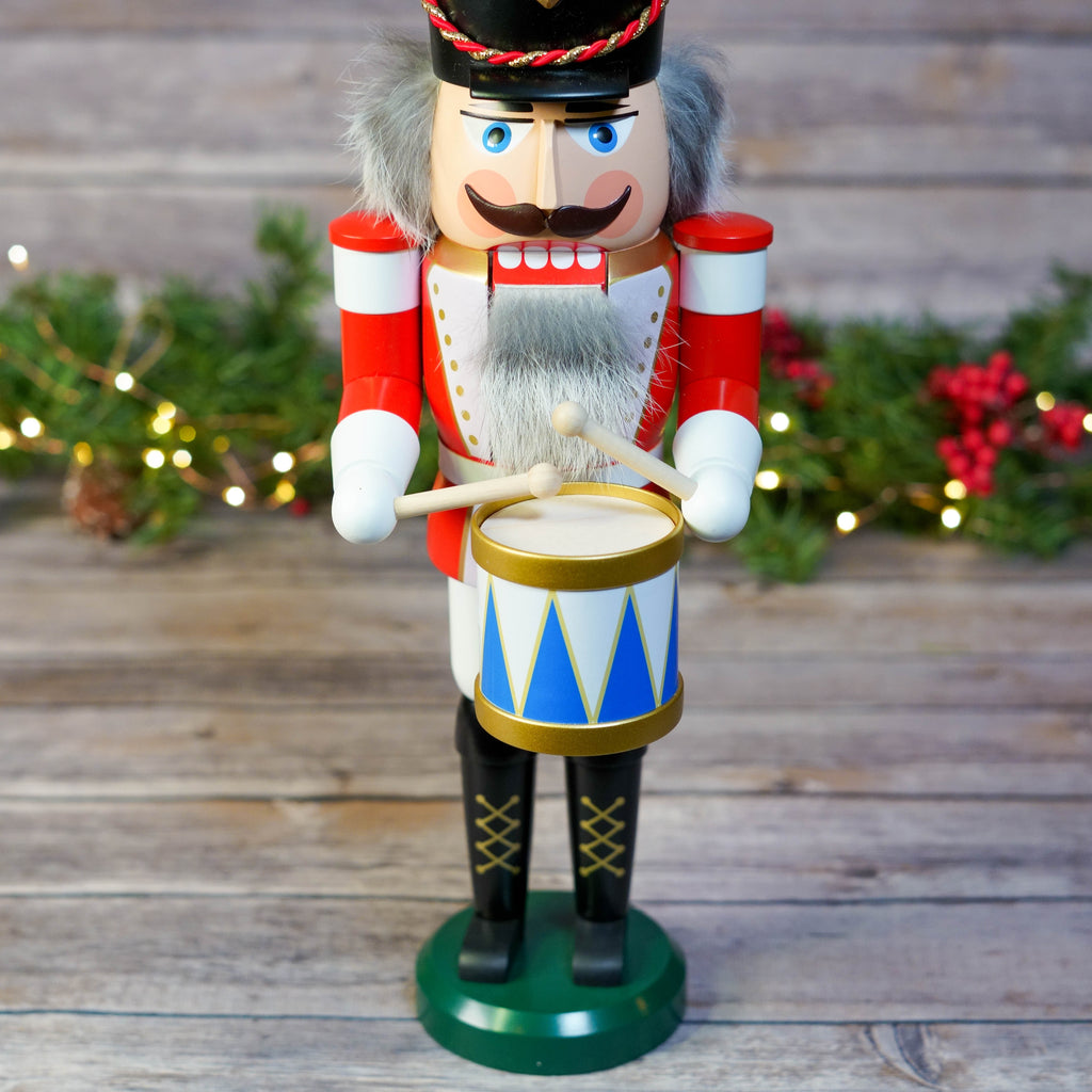 Side view of drummer nutcracker highlighting the drum and uniform