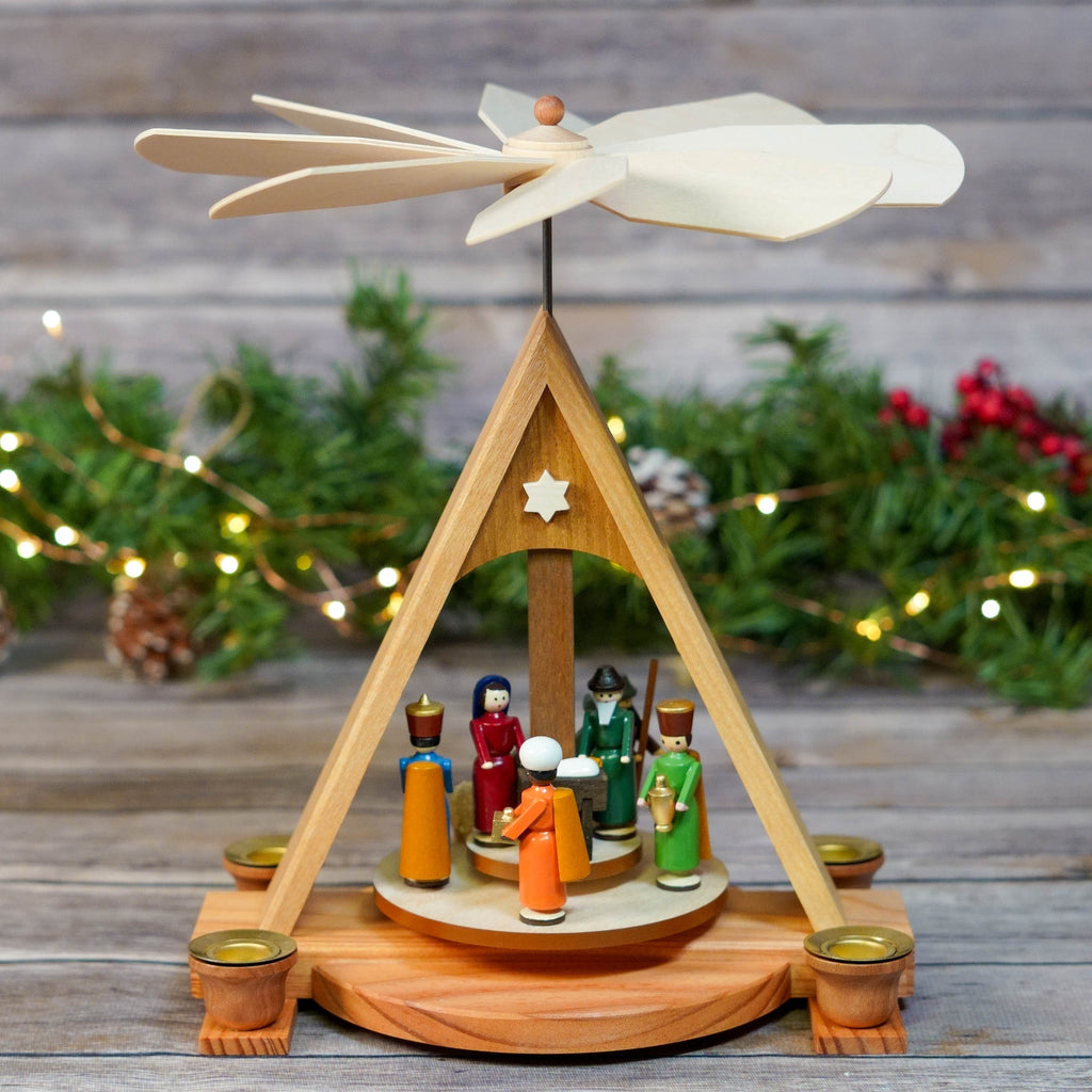 Close-up of Hand-painted Figurines in Nativity Pyramid