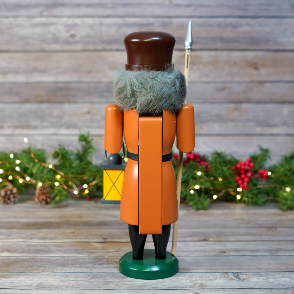 Nutcracker against festive backdrop with Christmas lights