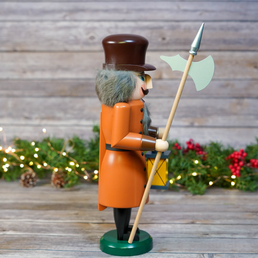 Detailed view of nutcracker's hand-painted features and wooden texture