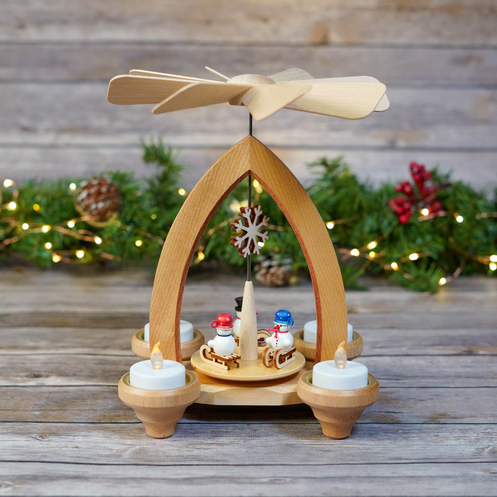 Traditional Ash Snowmen on Sleds Christmas Pyramid with festive backdrop
