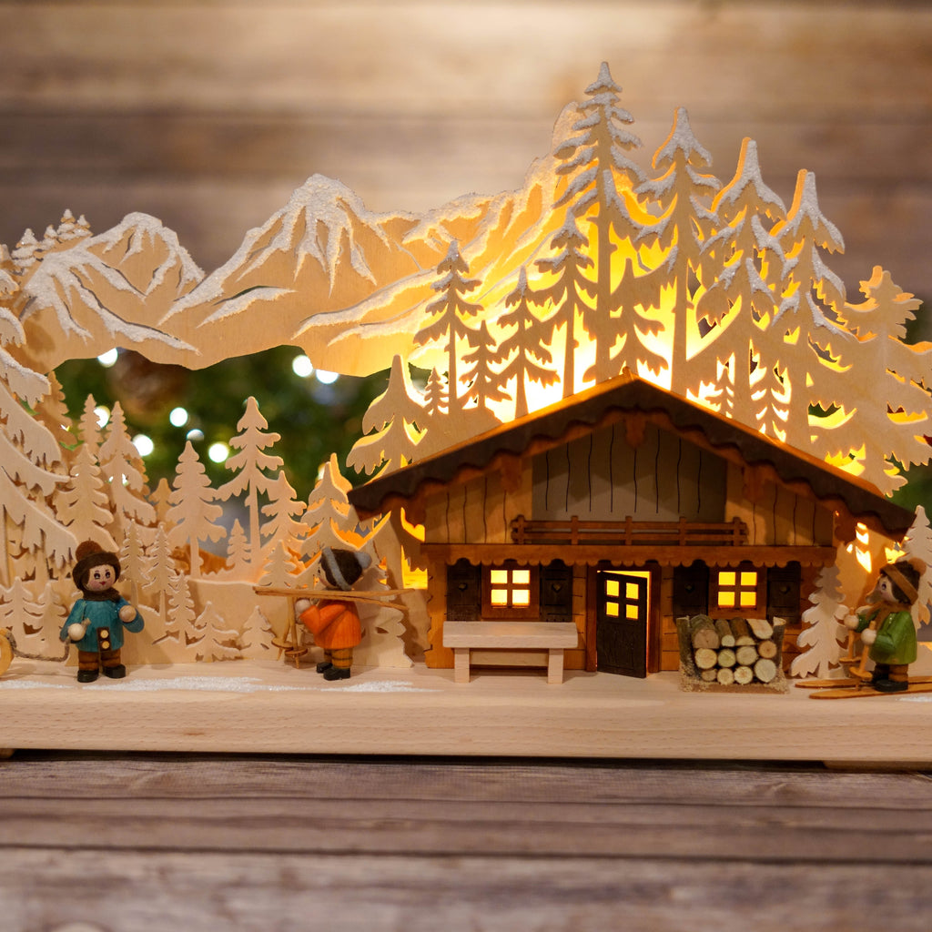 Detailed front view of wooden ski lodge with figurines