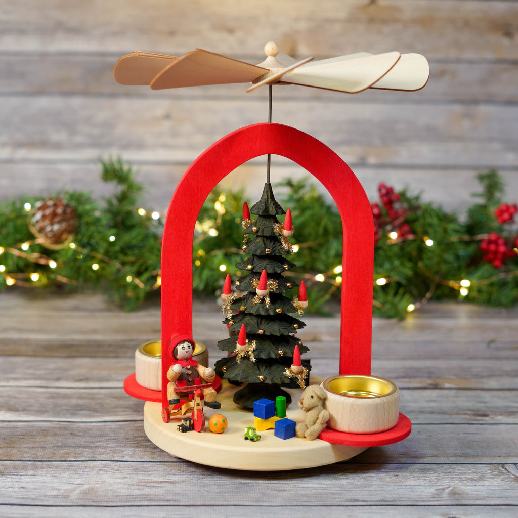 Traditional German Christmas Pyramid with red arch and rotating propeller