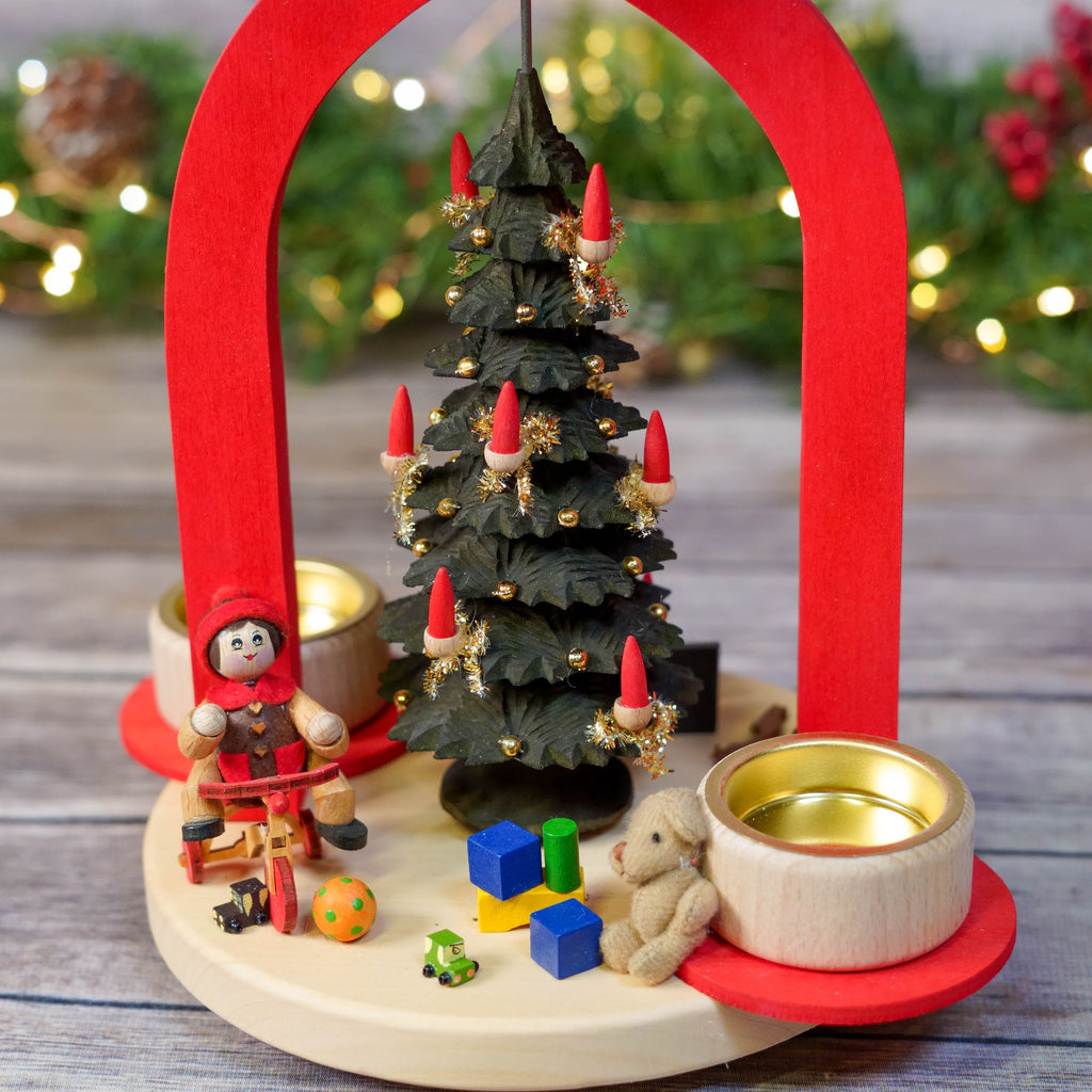 Close-up of miniature gifts under the Christmas tree in pyramid