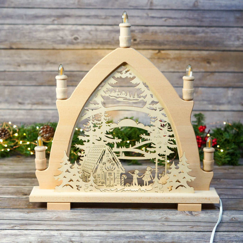 Close-up of Hansel and Gretel figures in wood Schwibbogen