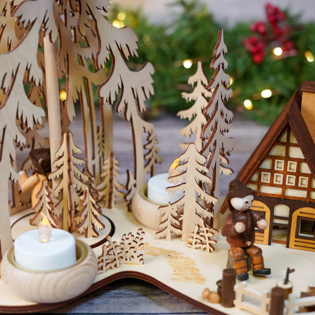Artisanal wood design featuring intricate tree and house details