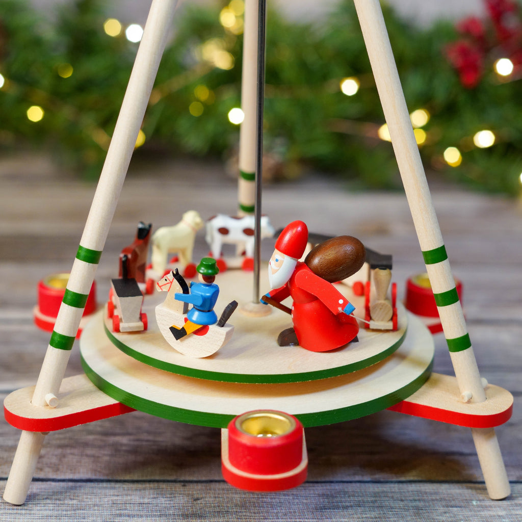 Christmas Pyramid with Wooden Figures and Red Accents