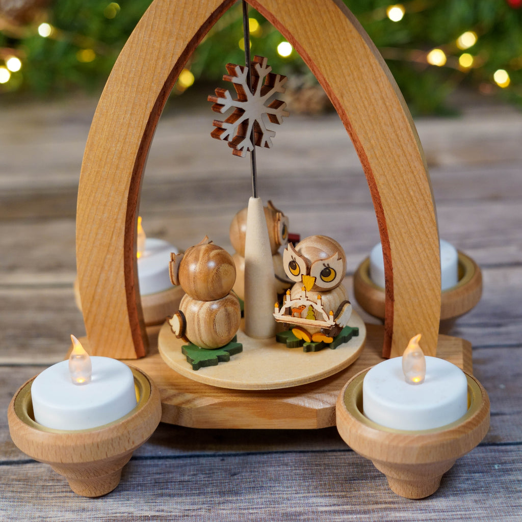 Festive Christmas Pyramid with Schwibbogen in holiday setting