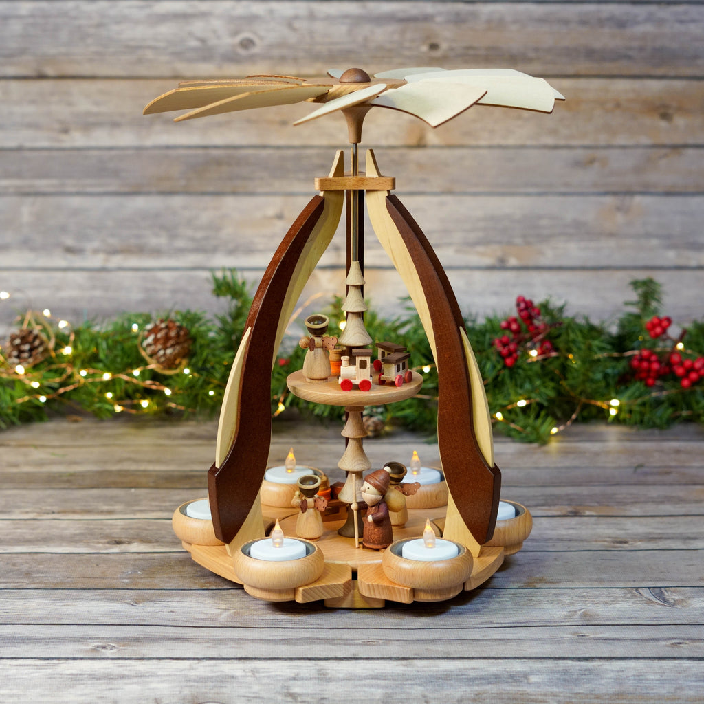 Traditional wooden Christmas pyramid with candles and figurines