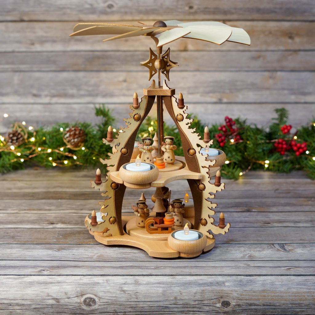 Close-up of angel figures on wooden Christmas pyramid