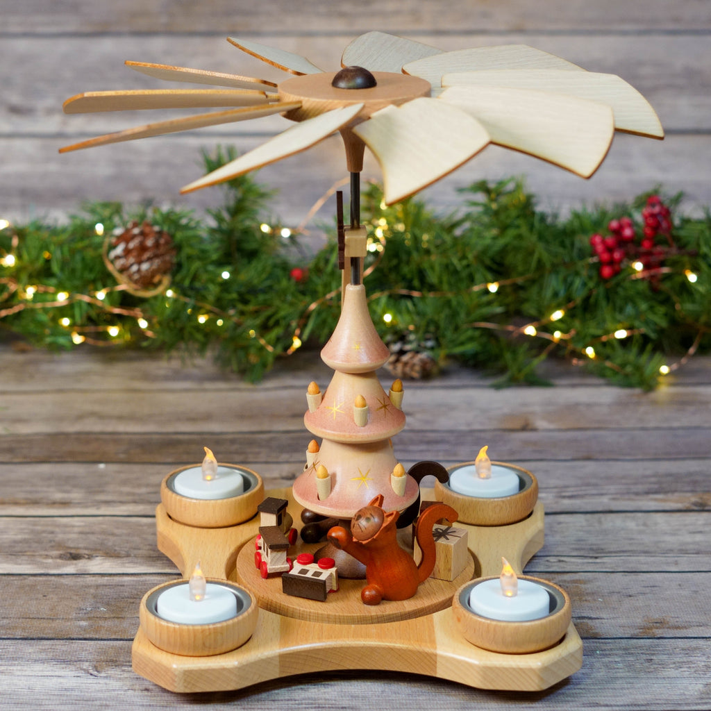 Traditional wooden Christmas Pyramid with cats and tree