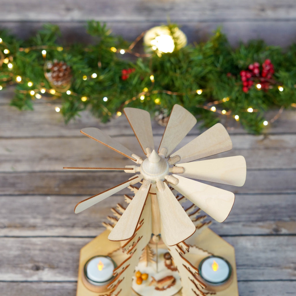 Close-up of the deer and pine cones on the Christmas Pyramid