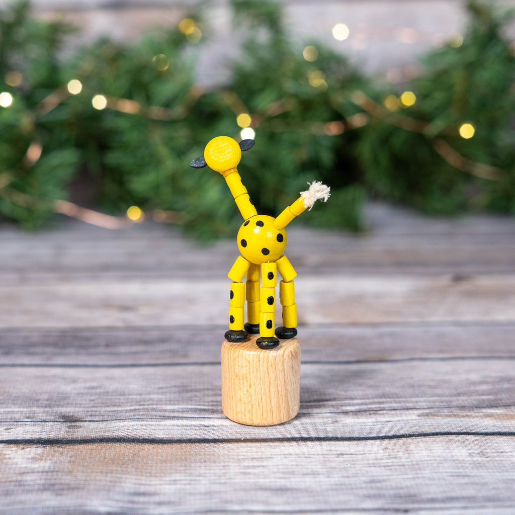 Durable wobbly giraffe toy in a festive setting