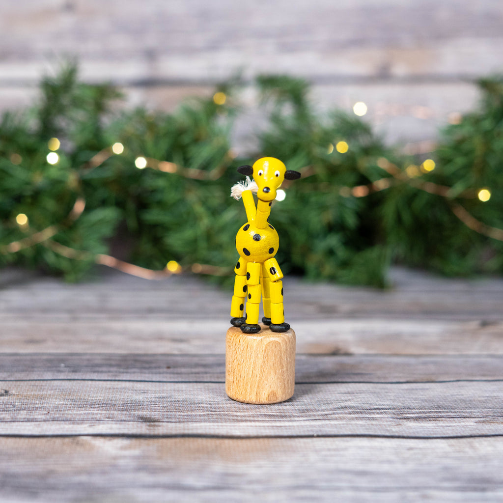 Educational toy giraffe in playful stance