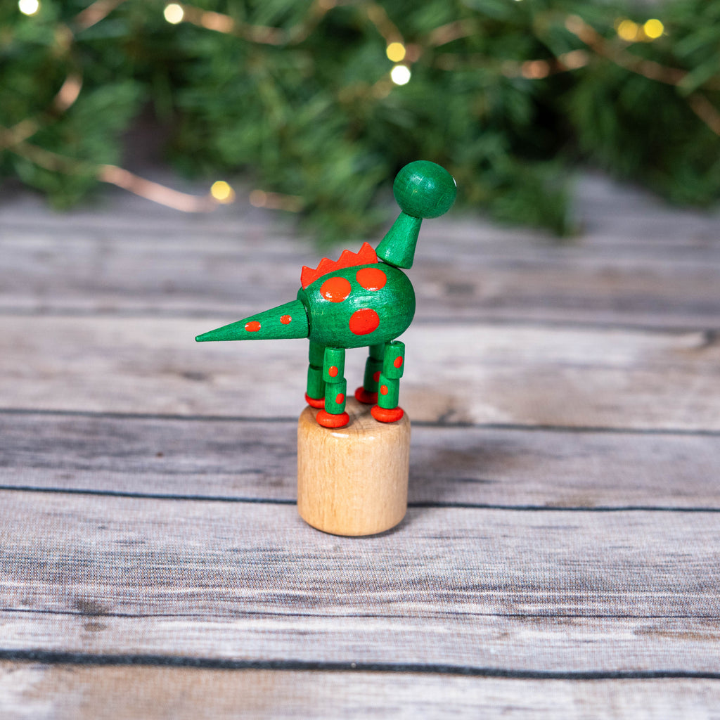 Decorative dinosaur toy on festive background